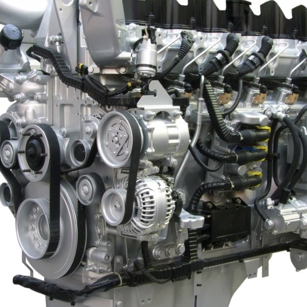 A modern diesel engine assembly on a white background, with exposed belts, pulleys, injectors, and wiring harnesses.